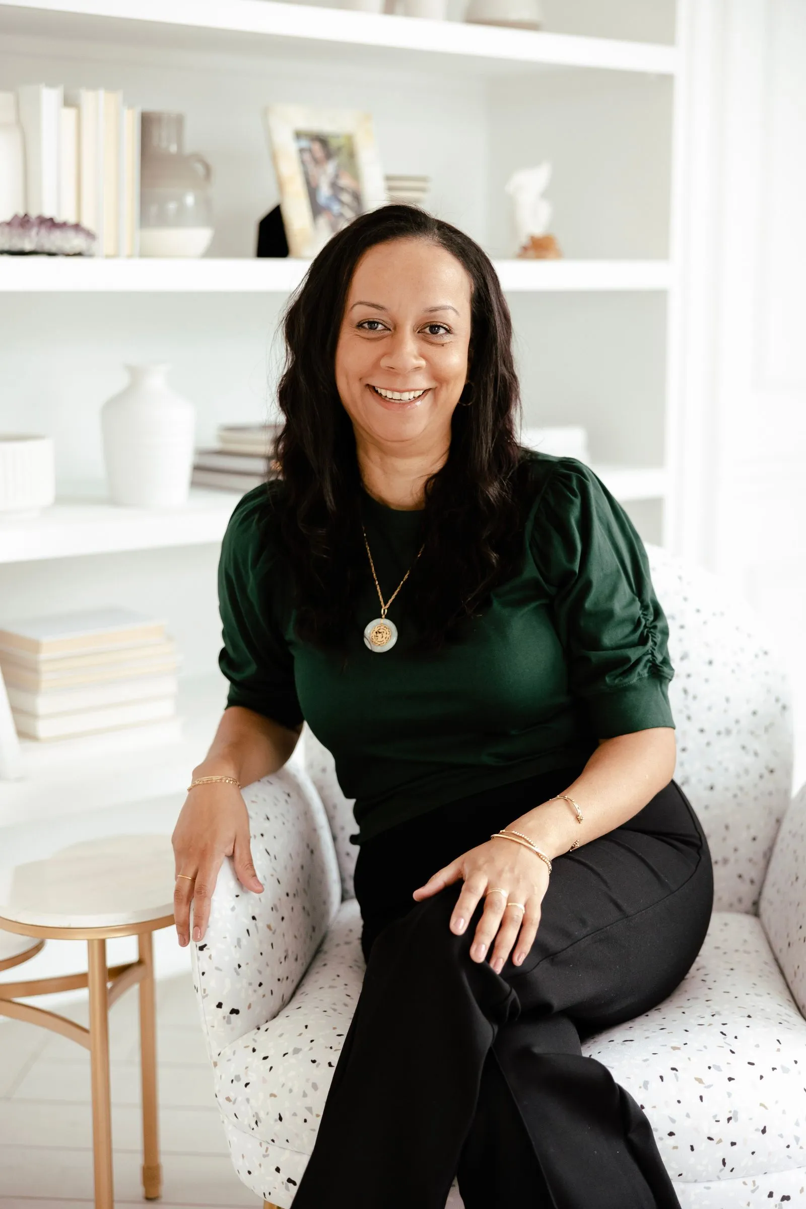 Gabrielle Thomas seated in a bright studio